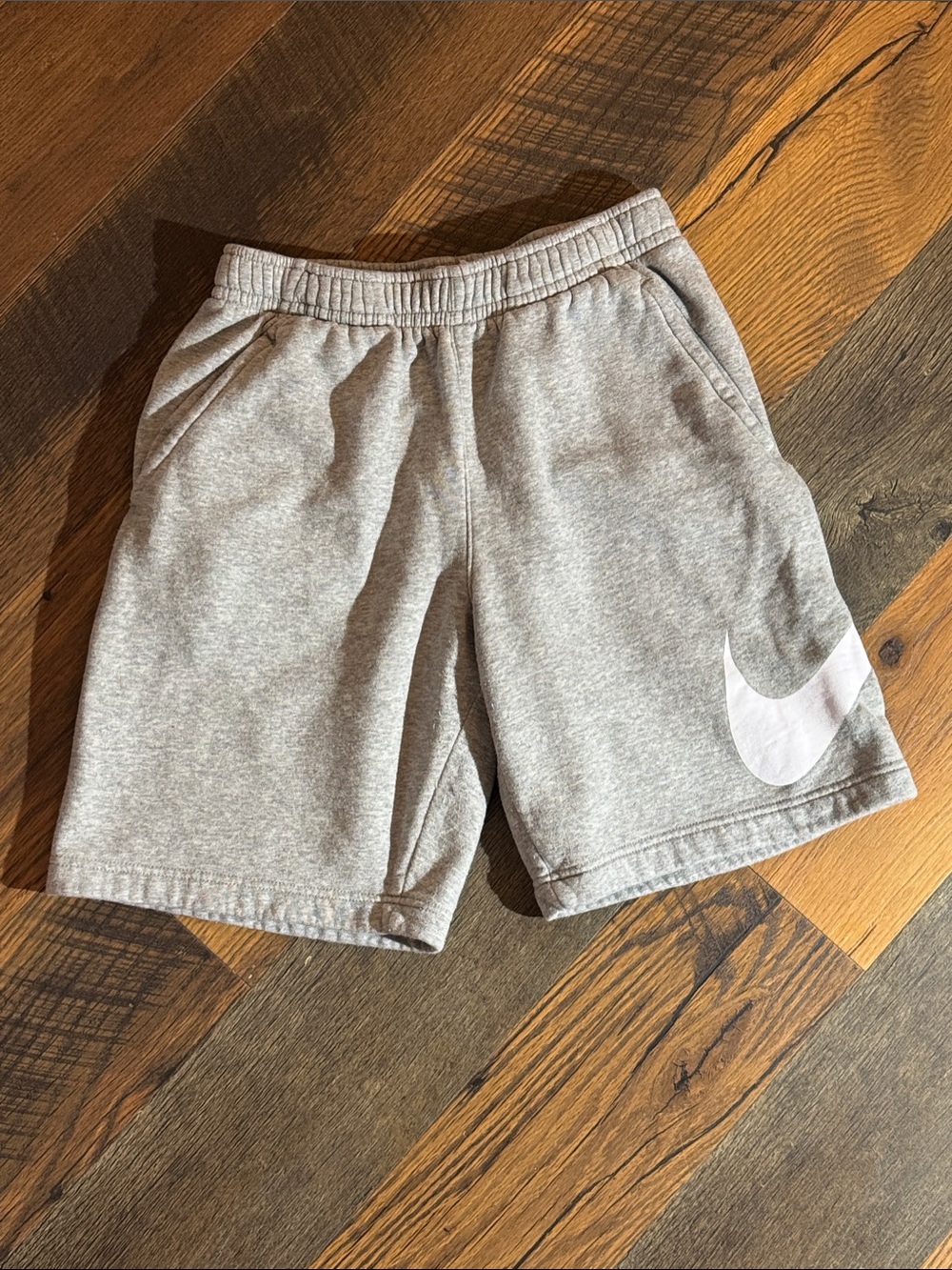 Nike Light Gray Athletic Shorts with White Swoosh
